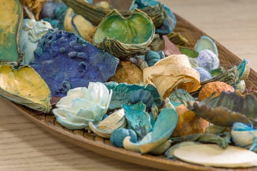 Aromatic dried fruit flowers and leaves on a wooden stand