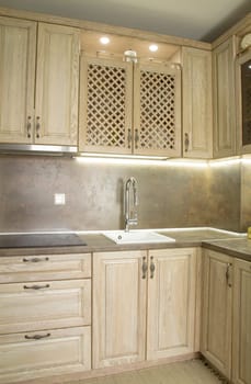 Details of vintage style kitchen furniture in beige brown color