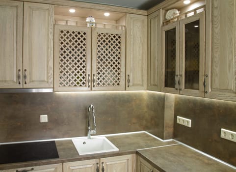 Details of vintage style kitchen furniture in beige brown color