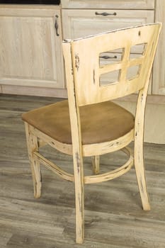 Details of vintage style kitchen furniture in beige brown color