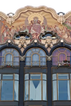 Windows and colorful mosaic, wall painting on the upper facade of the Török, Torok, Turkish Bank House, an example of Art Nouveau architecture in the city center of Budapest, Hungary 2022