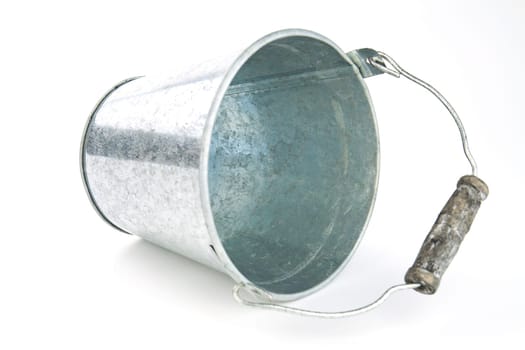 Galvanized empty bucket on a white background