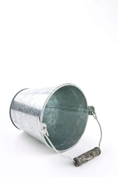 Galvanized empty bucket on a white background