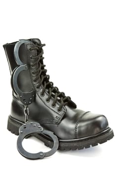 Police boots and handcuffs - equipment and aids or fetish