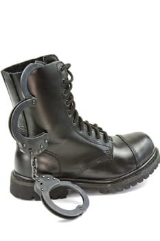 Police boots and handcuffs - equipment and aids or fetish