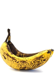 Two overripe bananas with large brown spots on a white background