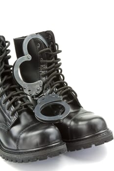 Police boots and handcuffs - equipment and aids or fetish