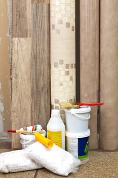 Laminate, vinyl wallpaper, paint cans and brushes to freshen the interior