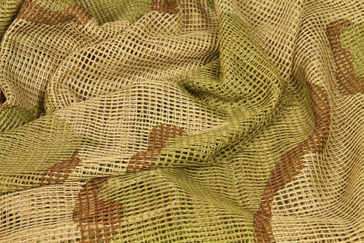 Cotton camouflage netting designed to wrap around the head or cover arms