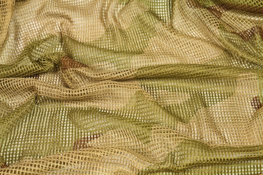 Cotton camouflage netting designed to wrap around the head or cover arms