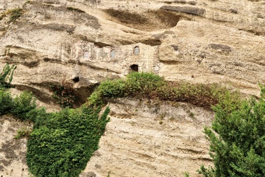 View onto the hidden facade of the Maximus Chapel, Cave, Maximuskapelle, Maximushöhle, built into a cave in a cliff of the Festungsberg, part of the Catacombs of Salzburg at the St. Peter*s Cemetery, Salzburg, Austria 2022