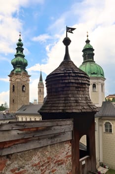 Inside the catacombs of Salzburg at the St., Saint Peter's Cemetery, Petersfriedhof, view from the Getrauden Chapel, Getraudenkapelle onto different bell, clock towers, Salzburg, Austria 2022