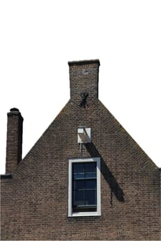 The gable of an apartment building, blue sky in the background