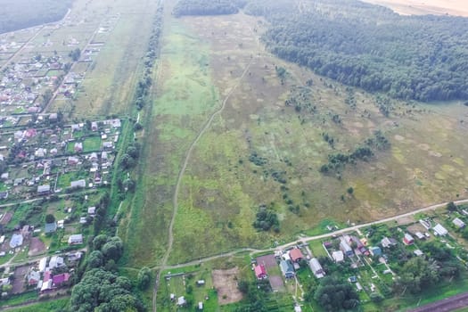 Top view of the village, fields and forests near the village
