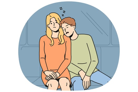 Subway passenger sleeps on shoulder of woman embarrassed by tactlessness of unfamiliar guy invading personal space. Man and girl, tired at work, ride in subway car or ground electric train