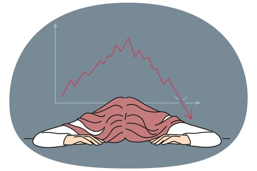 Bankrupt businesswoman put head on table near chart demonstrating crisis fall of stock market. Bankrupt woman investor upset by bad news about stock price decline or fed rate cut for lending