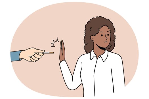 African American woman refusing to smoke making prohibition gesture near hand with cigarette made of tobacco and nicotine. Ethnic girl wants to quit smoke and fight addictive bad habits