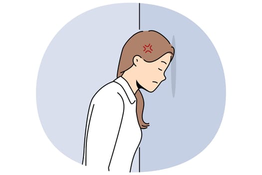Woman bangs head against wall because of mental problems or failures in personal life. Girl stands with eyes closed, inventing way to solve problems that have arisen and in need of moral support.
