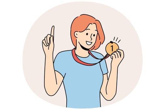 Woman with medal for first place won sports competition and is proud of trophy pointing finger up. Girl champion boasts of award for winning olympiad or participants in competition among colleagues