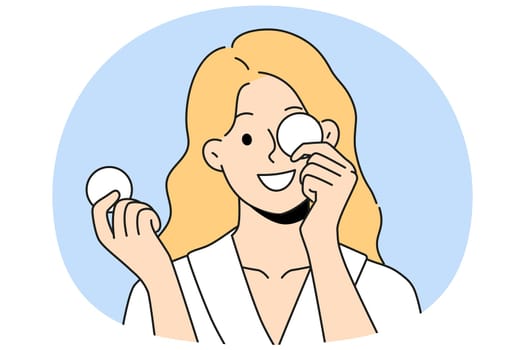 Woman with cotton pads for removing makeup and mascara with lipstick smiling getting ready for bed. Beautiful girl uses cotton pads for cosmetic purposes, wanting to impress boyfriend
