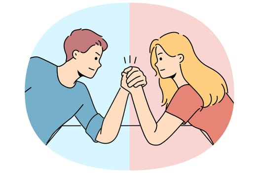 Arm wrestling between couple of man and woman for concept of fighting for leadership in family. Guy with girl compete who is stronger competing for position in company or leadership in team