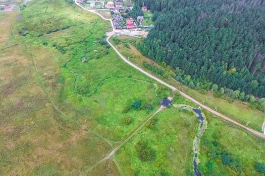 Top view of the village, fields and forests near the village