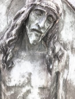 Jesus Christ. An ancient statue. Religion, faith, death, suffering, immortality, God concept.