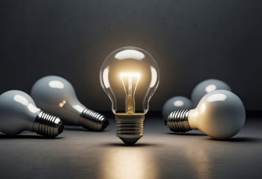 A single glowing light bulb standing upright among several unlit bulbs on a dark background, symbolizing innovation and ideas.