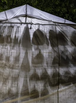 Detail of bags hanging at a fair, purchase