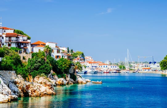 Old town view of Skiathos island, Sporades, Greece. Greek traditional architecture and aegean sea. Popular summer holiday destination scene.