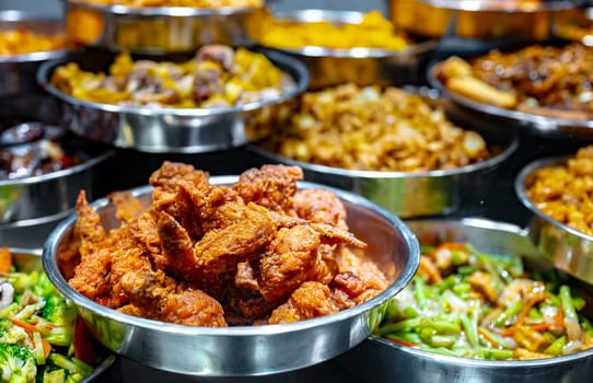 Traditional Asian dishes sold in a shopping mall food court in Singapore.