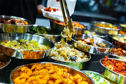 Traditional Asian dishes sold in a shopping mall food court in Singapore.