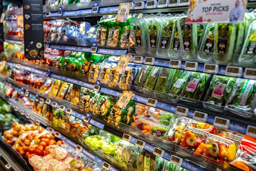 SINGAPORE - MAY 11, 2024: Variety of food products put up for sale in a commercial refrigerator