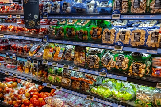 SINGAPORE - MAY 11, 2024: Variety of food products put up for sale in a commercial refrigerator