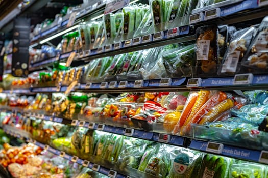 SINGAPORE - MAY 11, 2024: Variety of food products put up for sale in a commercial refrigerator