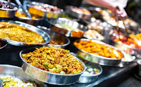 Traditional Asian dishes sold in a shopping mall food court in Singapore.