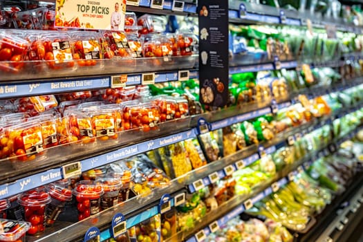 SINGAPORE - MAY 11, 2024: Variety of food products put up for sale in a commercial refrigerator