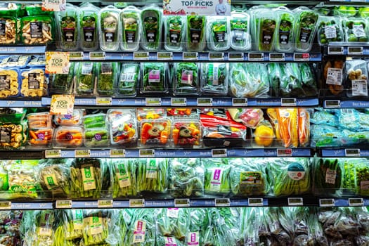 SINGAPORE - MAY 11, 2024: Variety of food products put up for sale in a commercial refrigerator