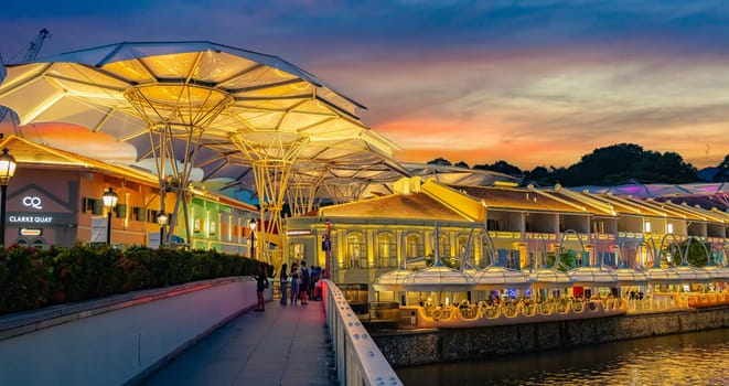 SINGAPORE - MAY 12, 2024: Clarke Quay after sunset, popular nightlife district of Singapore