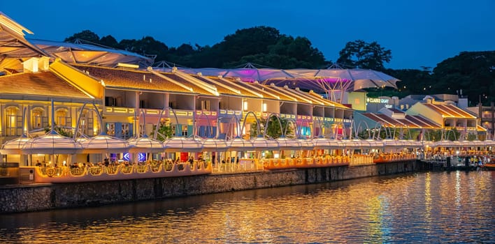 SINGAPORE - MAY 12, 2024: Clarke Quay after sunset, popular nightlife district of Singapore