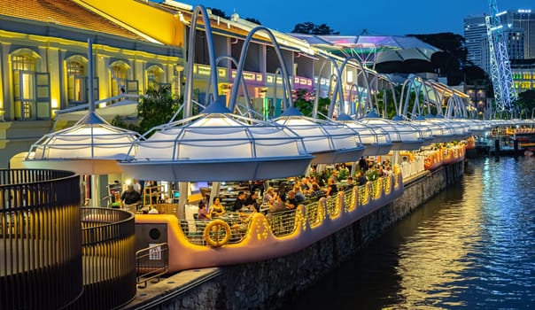 SINGAPORE - MAY 12, 2024: Clarke Quay after sunset, popular nightlife district of Singapore