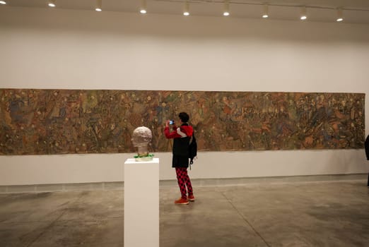 Venice, Italy - May 7 2024: Foreigners Everywhere 60th Venice Art Biennale in Venice. Crucifixion of fhe Soul by Magde Gill. Coloured inks on calico.