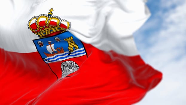 Close-up of the Cantabria flag waving in the wind. Cantabria is an autonomous community of Spain. White and red horizontal stripes with coat of arms. 3d illustration render. Selective focus. Close-up