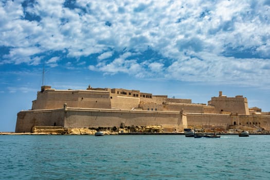 Fort St. Angelo, symbol of Malta's resilience, majestic stone walls, silent witness to rich history. Port in Birgu. Malta