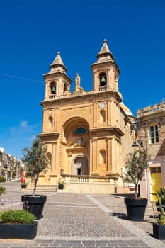 Beautiful Parish Church of Our Lady of Pompei, a prominent church with intricate architecture, overlooking the picturesque Marsaxlokk fishing village. Cultural heritage of Malta
