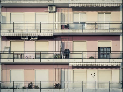 Vila Real de Santo Antonio, Portugal, April 12th 2024: View on pastel colored balconies of an apartment building in Portugal