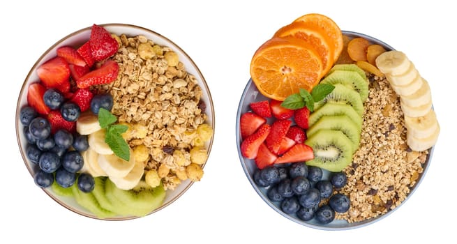 Granola with strawberries, kiwi, banana and blueberries in a round plate. Top view. Isolated background