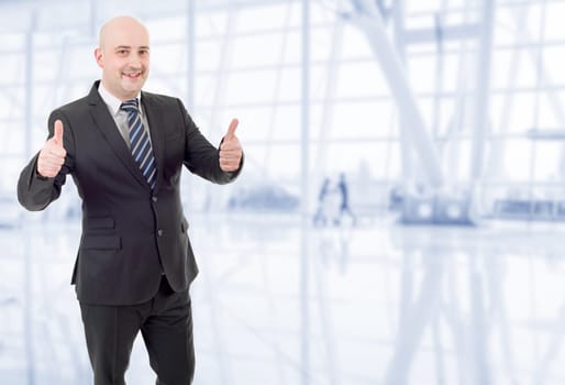 young business man going thumbs up, at the office