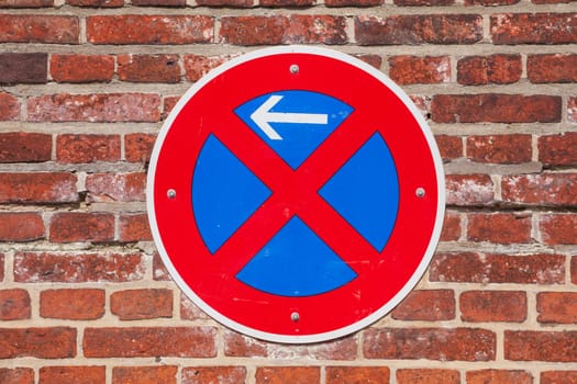 Absolute stopping ban, traffic sign on a brick wall, Germany