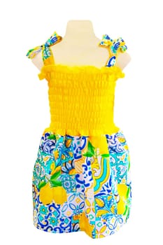 Dress isolated. Close-up of a colorful elegant stylish sleeveless yellow blue summer dress or sundress isolated on a white background. Clipping path. Girls stylish look.